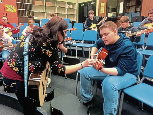 648107_web1_vnd-playguitar-012119