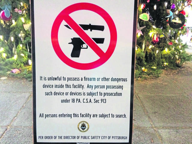 664714_web1_Gun-sign