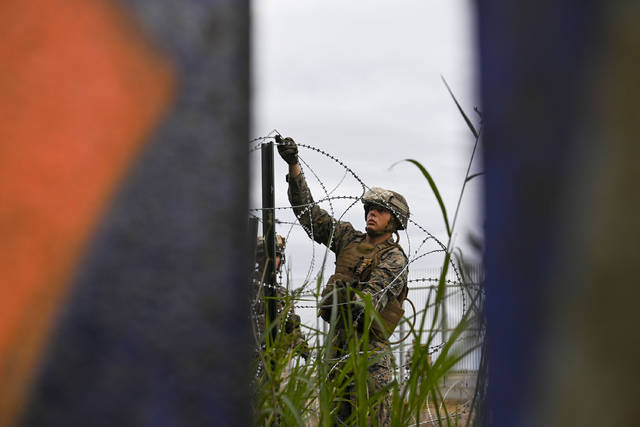 690311_web1_border-troops-a4f4fe50-23fe-11e9-90cd-dedb0c92dc17