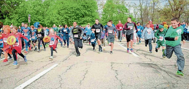 Superhero run in North Park benefits abused, neglected children