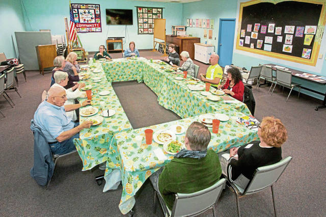 1073738_web1_shr-AroundTheTable01-050219