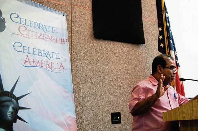 1368271_web1_gtr-newcitizens003-070419