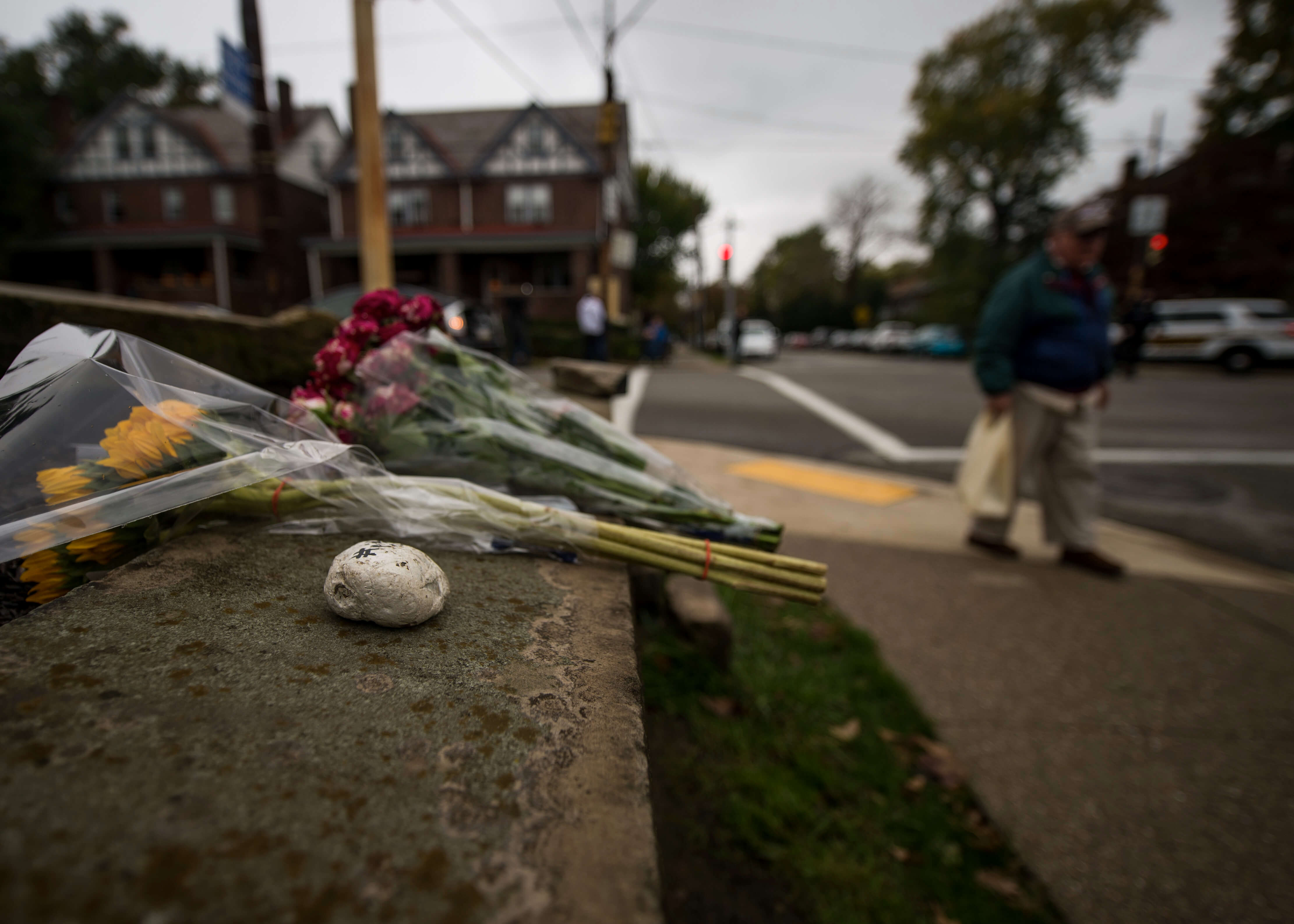 Flowers are left near the scene of a mass shooting at Tree of Life Synagogue in Squirrel Hill on Oct. 27, 2018.