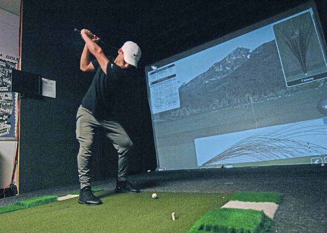 Baldwin celebrates reopening of indoor golf practice room