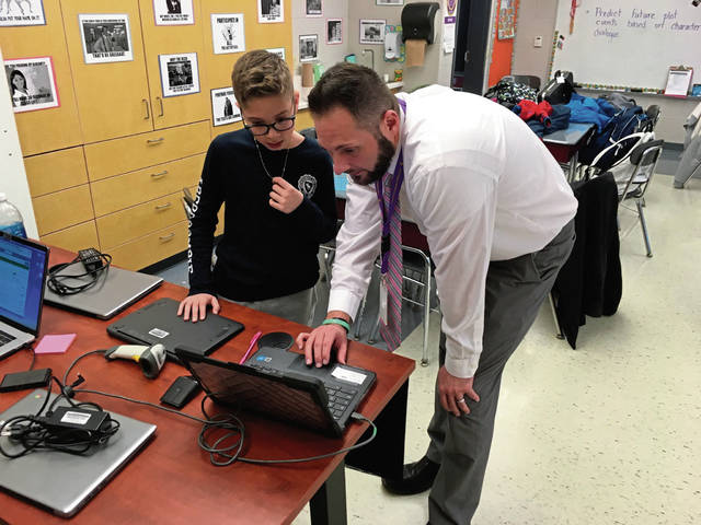 Plum elementary students learn teamwork, other skills fixing classmates’ computers