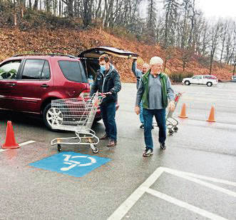 Food banks make adjustments so they can serve while keeping people safe