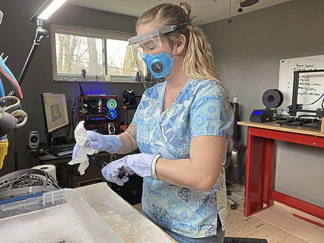 Couple puts 3D printer to work making masks for front lines
