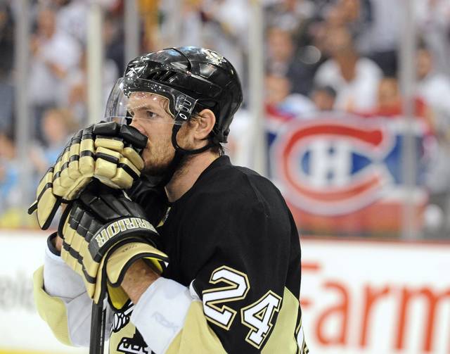 Pittsburgh Penguin goalie Marc-Andre Fleury blocks a shot in the first  period of the Penguins 5 to 3 win over the New York Rangers at the Mellon  Arena in Pittsburgh, Pennsylvania on