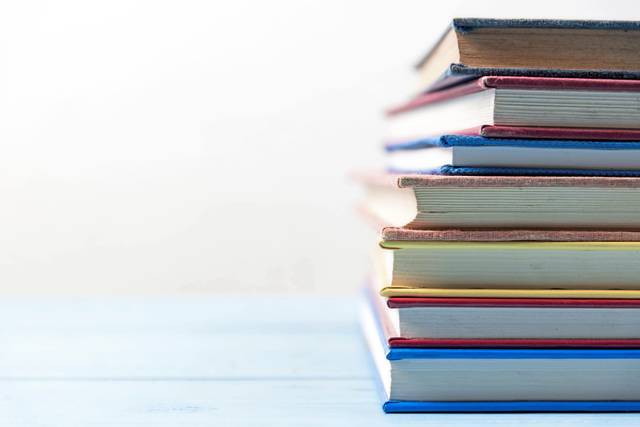 3284307_web1_WEB-stack-of-books