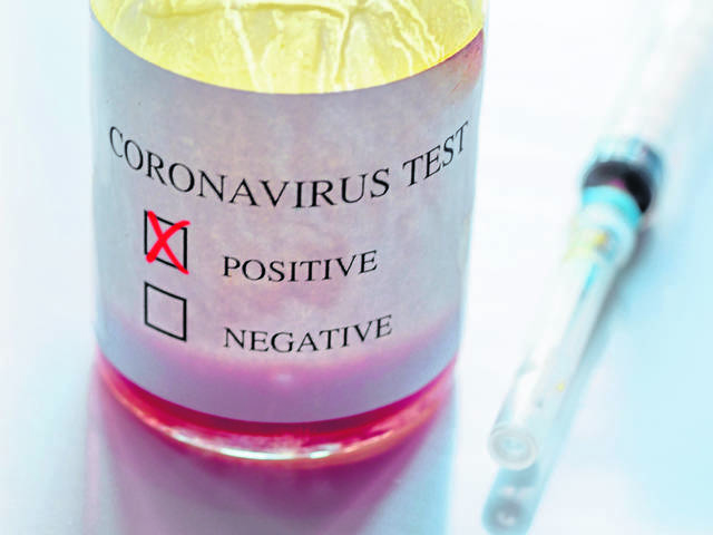 3498791_web1_Coronavirus_testbottle_syringe