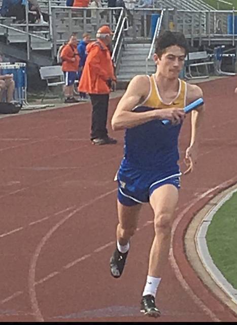 Hampton football players give boost to boys track and field team