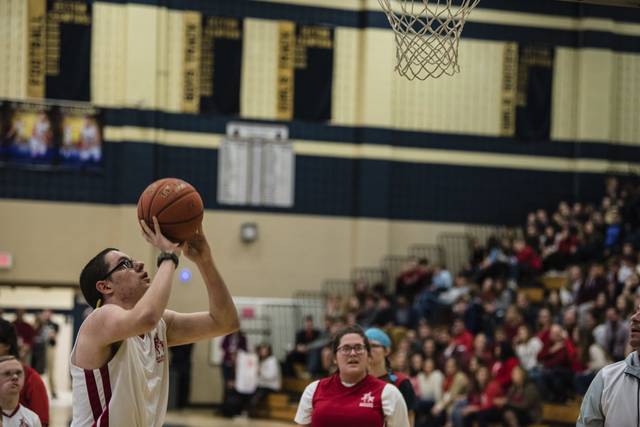 Despite cancellation of annual event, Franklin Regional basketball boosters make donation to Clelian Heights