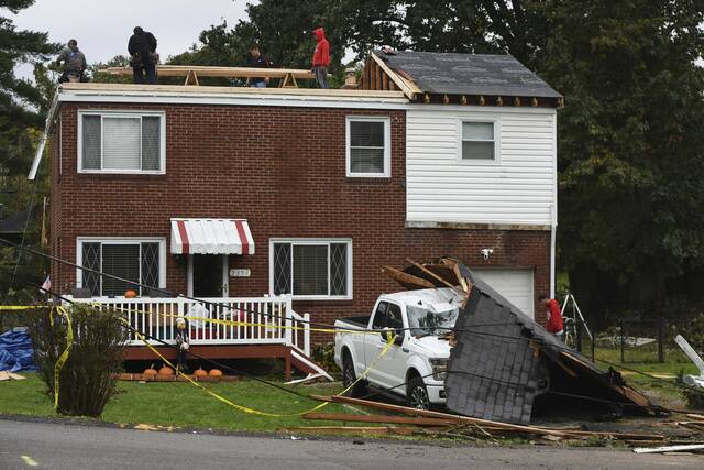 Cleanup begins after tornadoes topple trees onto power lines, homes