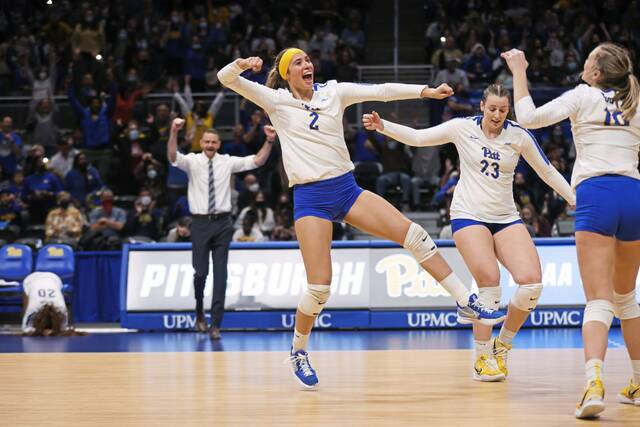 Pitt’s Valeria Vazquez Gomez (2) celebrates with Kayla Lund (23) and Rachel Fairbanks (10) during a match against Penn State in the second round of the NCAA tournament Dec. 4, 2021, at Petersen Events Center.