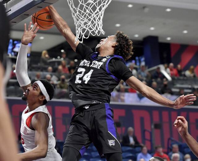 Weber State’s Jamison Overton blocks the shot of Duquesne’s Kevin Easley Jr. in the second half on Monday, Nov. 15, 2021 at UPMC Cooper Fieldhouse.