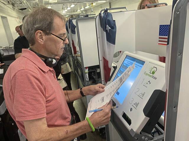 5468337_web1_gtr-votingmachine