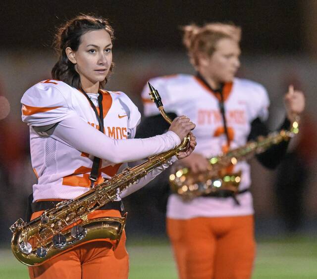 Springdale duo kicks it into gear with football team, band