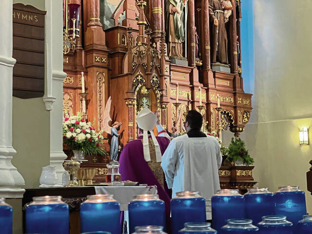 5656501_web1_BIshop-and-Father-Pujol