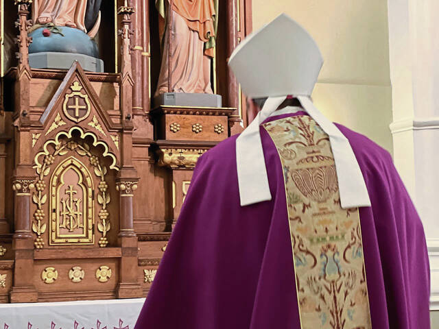 5656501_web1_Bishop-Larry-Kulick-at-the-altar