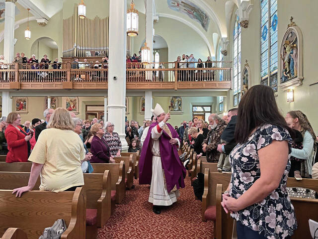 5656501_web1_Bishop-Larry-Kulick-blesses-the-church