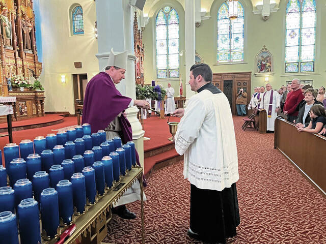 5656501_web1_Bishop-and-Father-Chris-Pujol