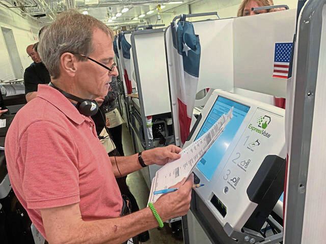 6043979_web1_gtr-votingmachine