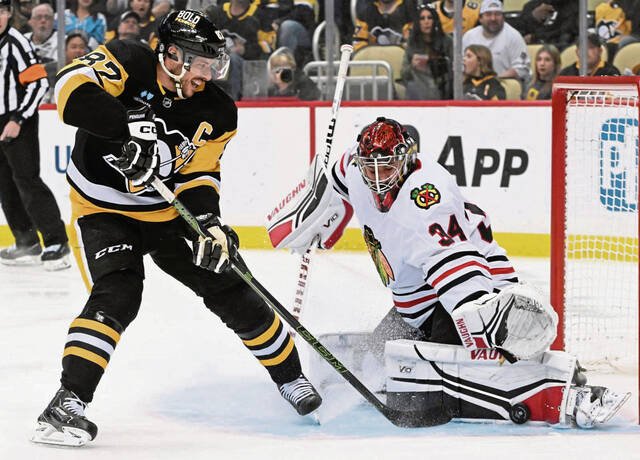 6090336_web1_ptr-PensBlackhawks01-041223jpg