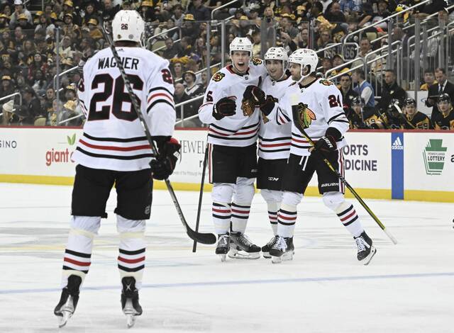 6090336_web1_ptr-PensBlackhawks09-041223jpg