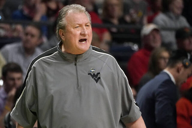 West Virginia’s Huggins agrees to $1M pay cut, 3-game suspension for homophobic slur