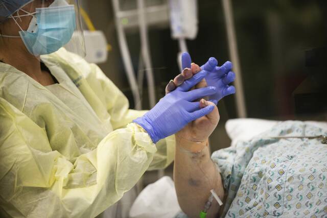 Holding onto hope inside a covid ICU: ‘It’s like working in a war zone’