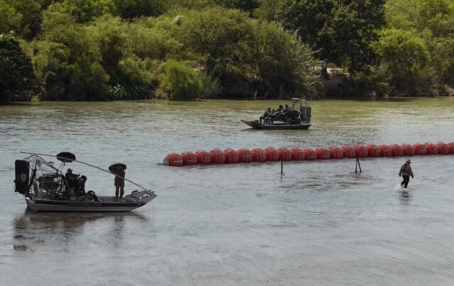 Mexico recovers 2 bodies from the Rio Grande, 1 found near a floating barrier that Texas installed