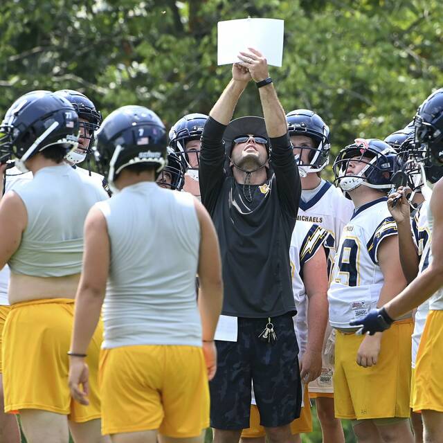 Returning coach brings dose of intensity to Carmichaels program