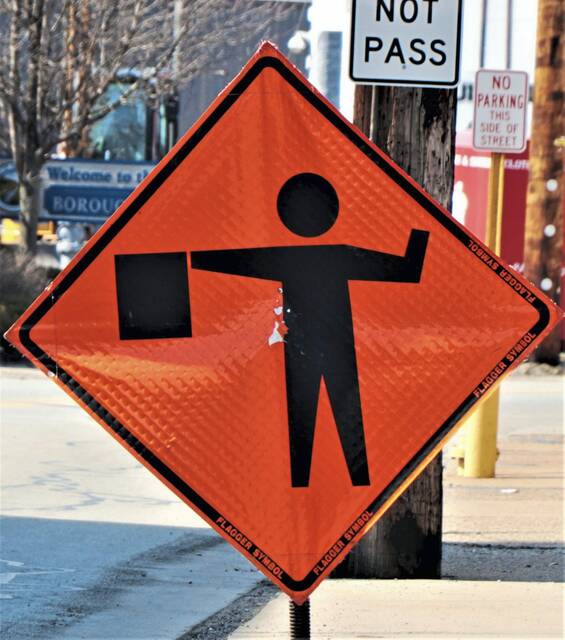 6516361_web1_WEB-road-construction-sign-flagger
