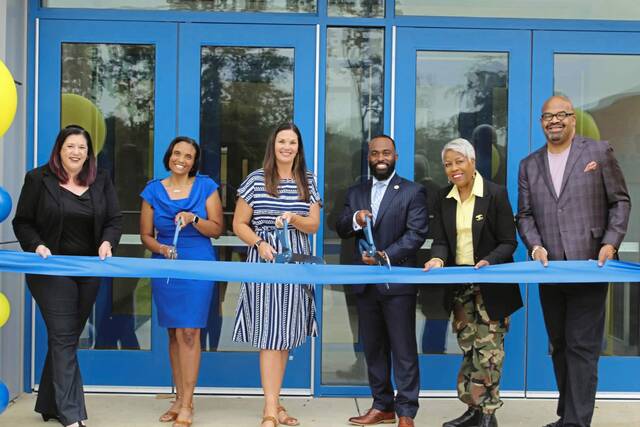 6606440_web1_php-RibbonCutting-100523