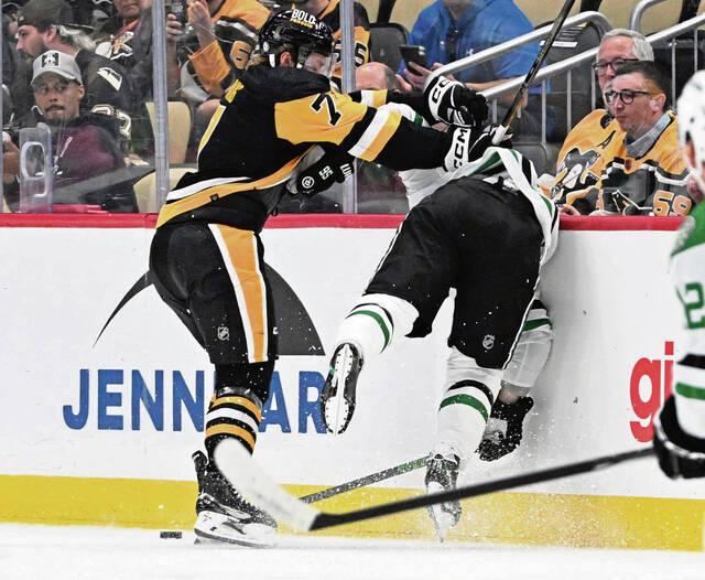 Pittsburgh Penguins' Andrew Ference (7) celebrates his game