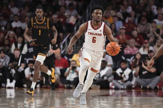 Bronny James makes college debut for USC nearly 5 months after cardiac arrest<span class="headline-video">Video <i class="fa-solid fa-circle-play"></i></span>
