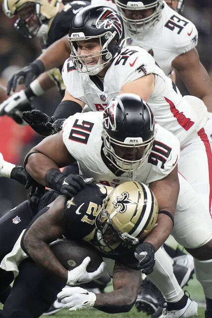 New Orleans Saints running back Jamaal Williams (21) carries the ball against the Atlanta Falcons on Jan. 7, 2024, in New Orleans.