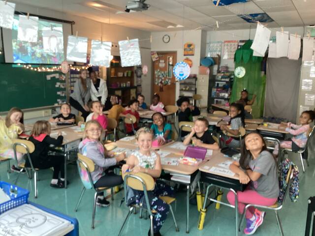 6998203_web1_GHS-juniors-Aubriauna-Baldwin-and-Ava-Cecere-teaching-Spanish-to-Ms.-Hartman-s-class-at-Clevend-Steward-Elementary