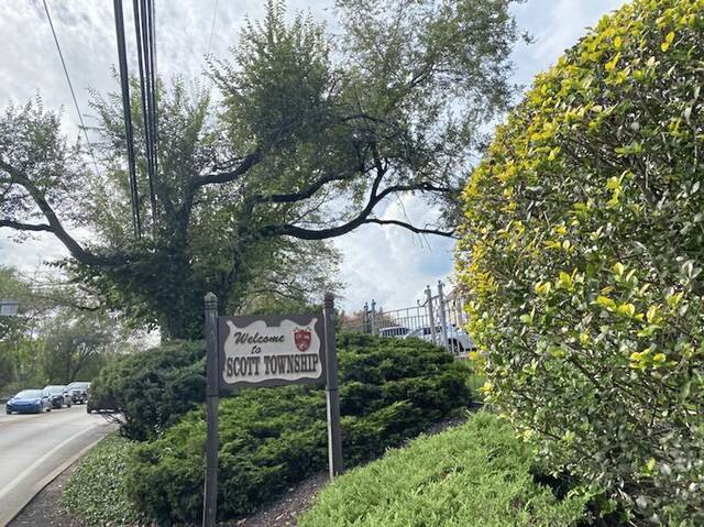 7024433_web1_NNN-Scott-Sign
