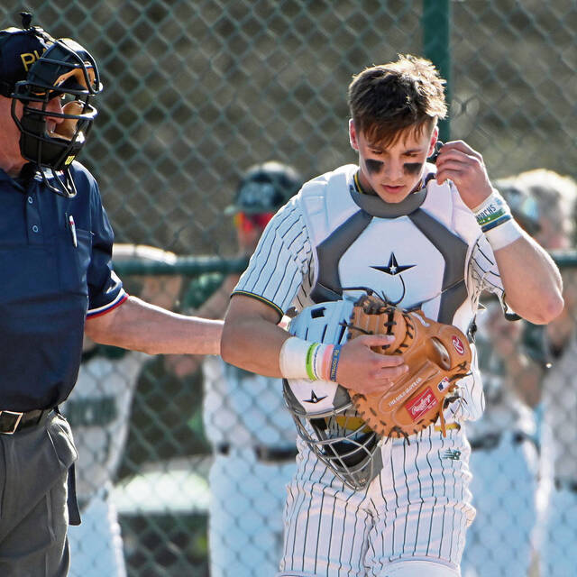 Earpieces let high school catchers receive in-game coaching