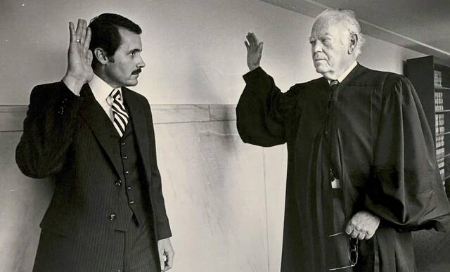 7290475_web1_ptr-JohnsonOBIT-Jerry-Johnson-being-sworn-in-by-Barron-McCune