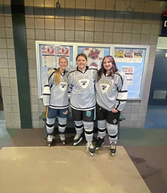 Hampton girls hockey players spring into action