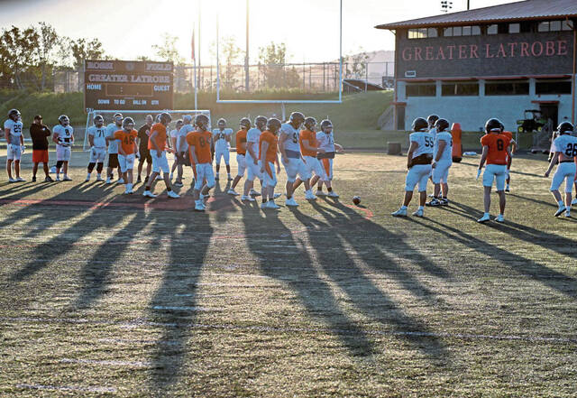 Latrobe lines up for practice early in the morning on the first day of high school football camp Monday, Aug. 12, 2024, at Greater Latrobe High School.