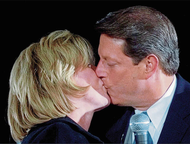 7634877_web1_al-and-tipper-gore-smooch-in-2000----AP00110501216