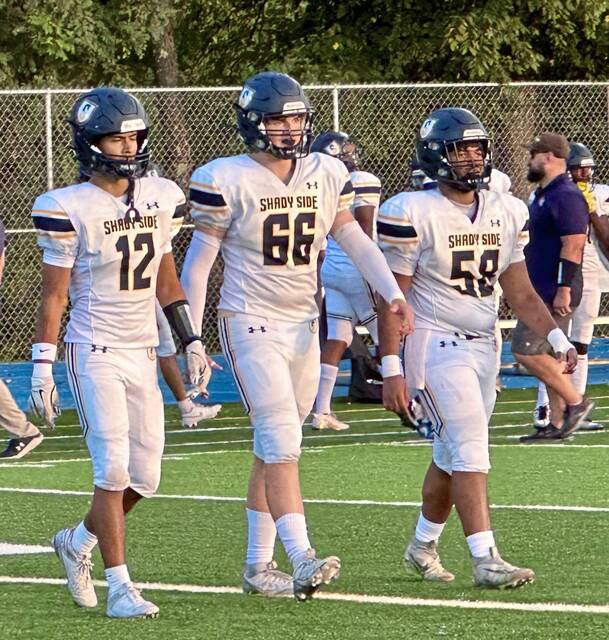 Led by line, Shady Side Academy runs past Burrell