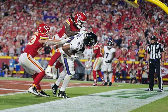 Chiefs hold off Ravens by inches on final play of NFL season opener