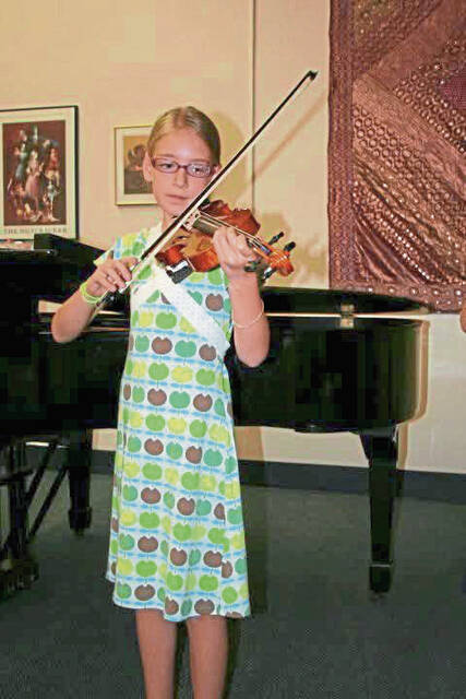 8134551_web1_her-violinist-011625-3