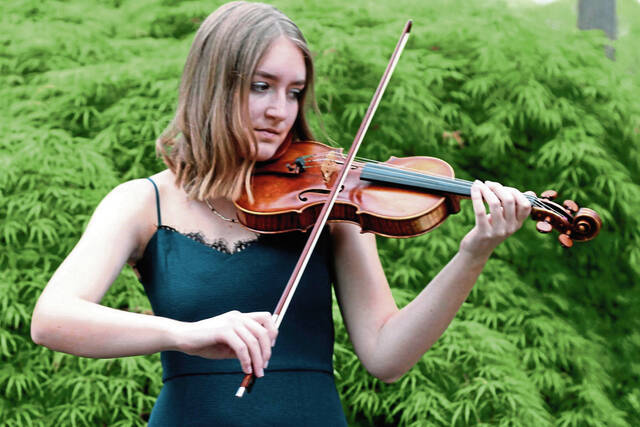 8134551_web1_her-violinist-013025