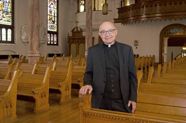 8433204_web1_Msgr.RogerStatnick