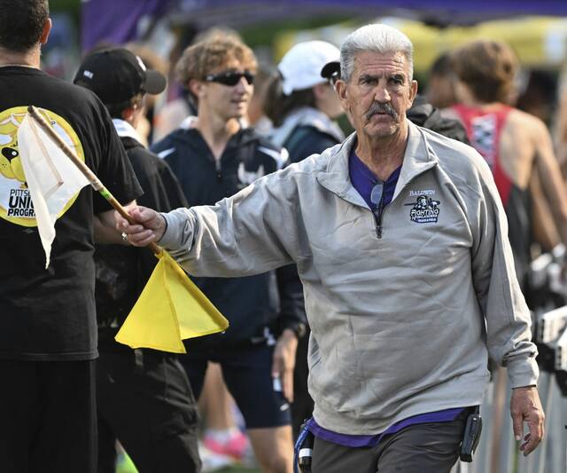 As Baldwin Invite’s meet director, Rich Wright strives to honor late coach Ed Helbig
